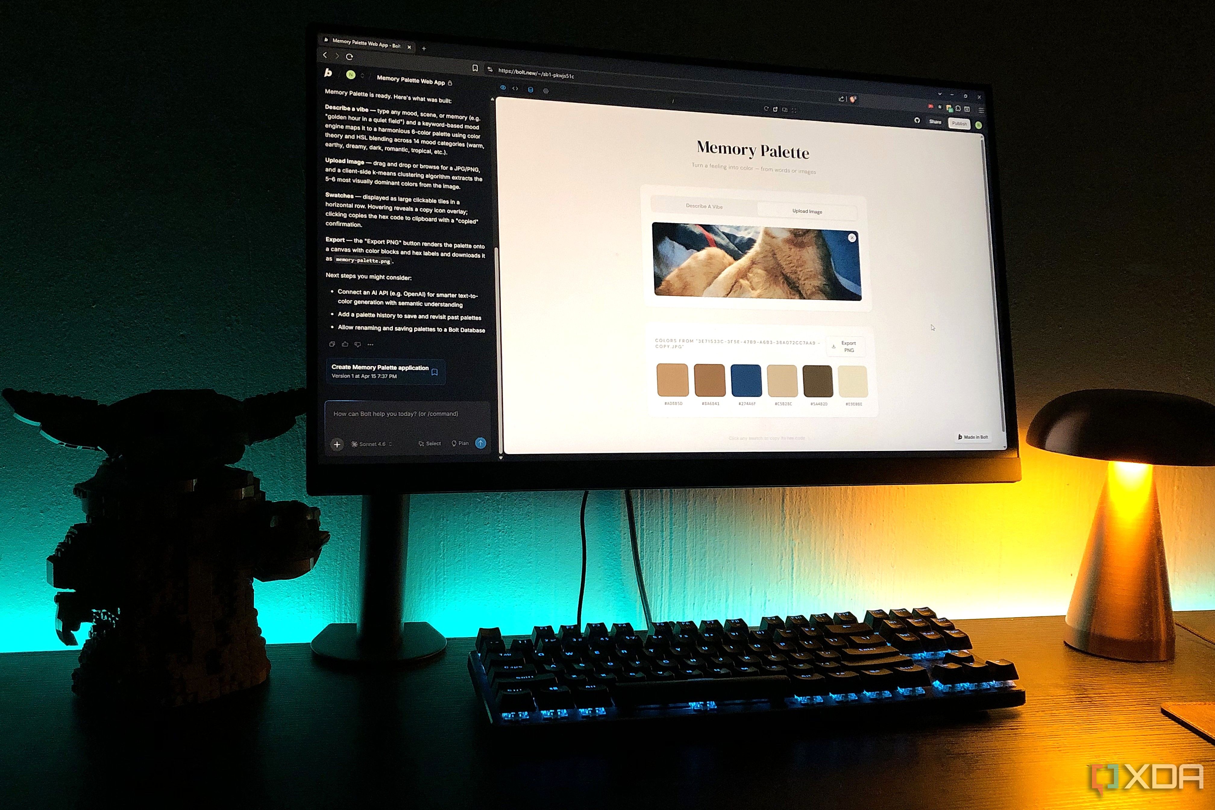 replit design on desktop pc, lamp and lego in view