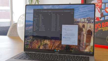 A Windows 11 laptop running File Explorer and showing the options window