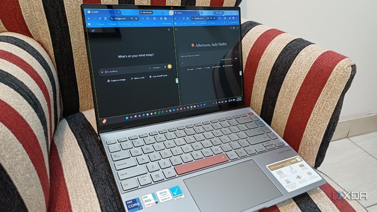 A laptop on a chair with strips with a laptop on it with Claude and ChatGPT in split-screen mode