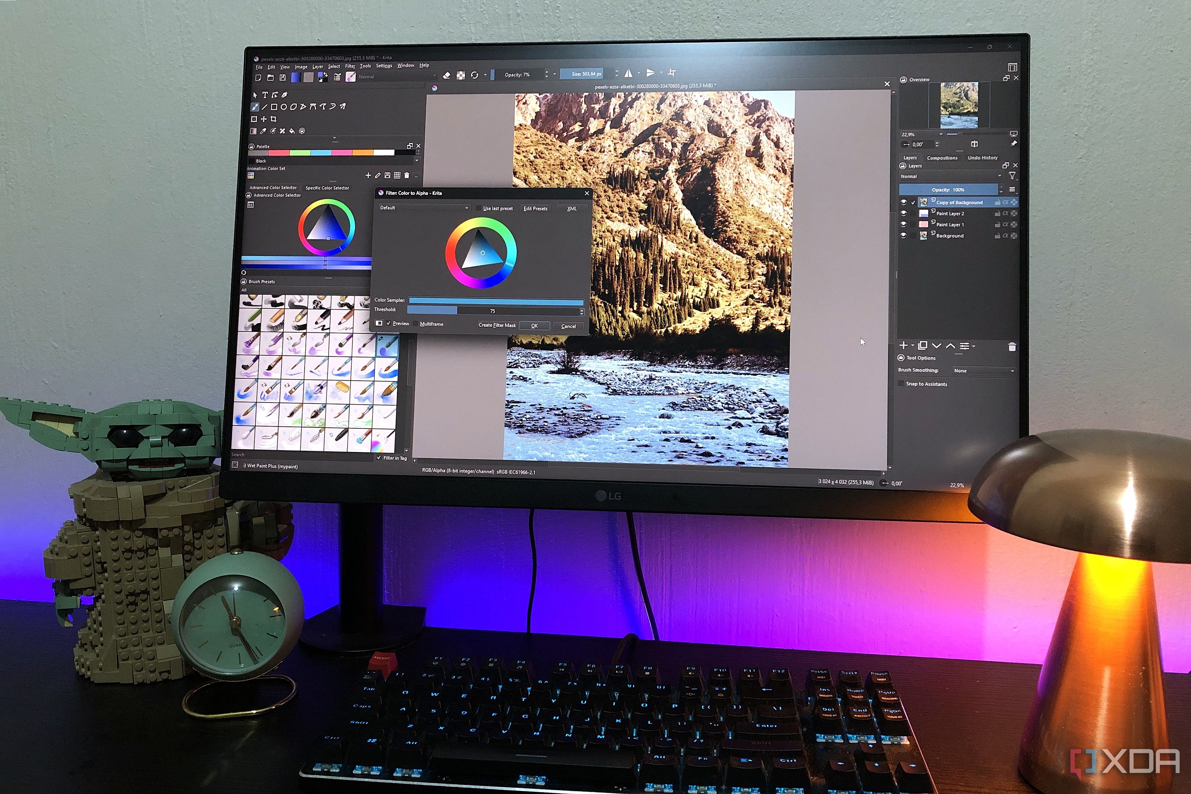 editing image in krita on desktop pc, lego and lamp in view
