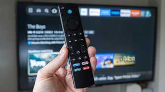 The Fire TV 4K Stick Max remote in front of a TV