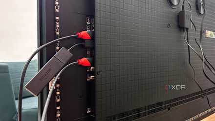 HDMI cables plugged into the ports on a 4K TV.