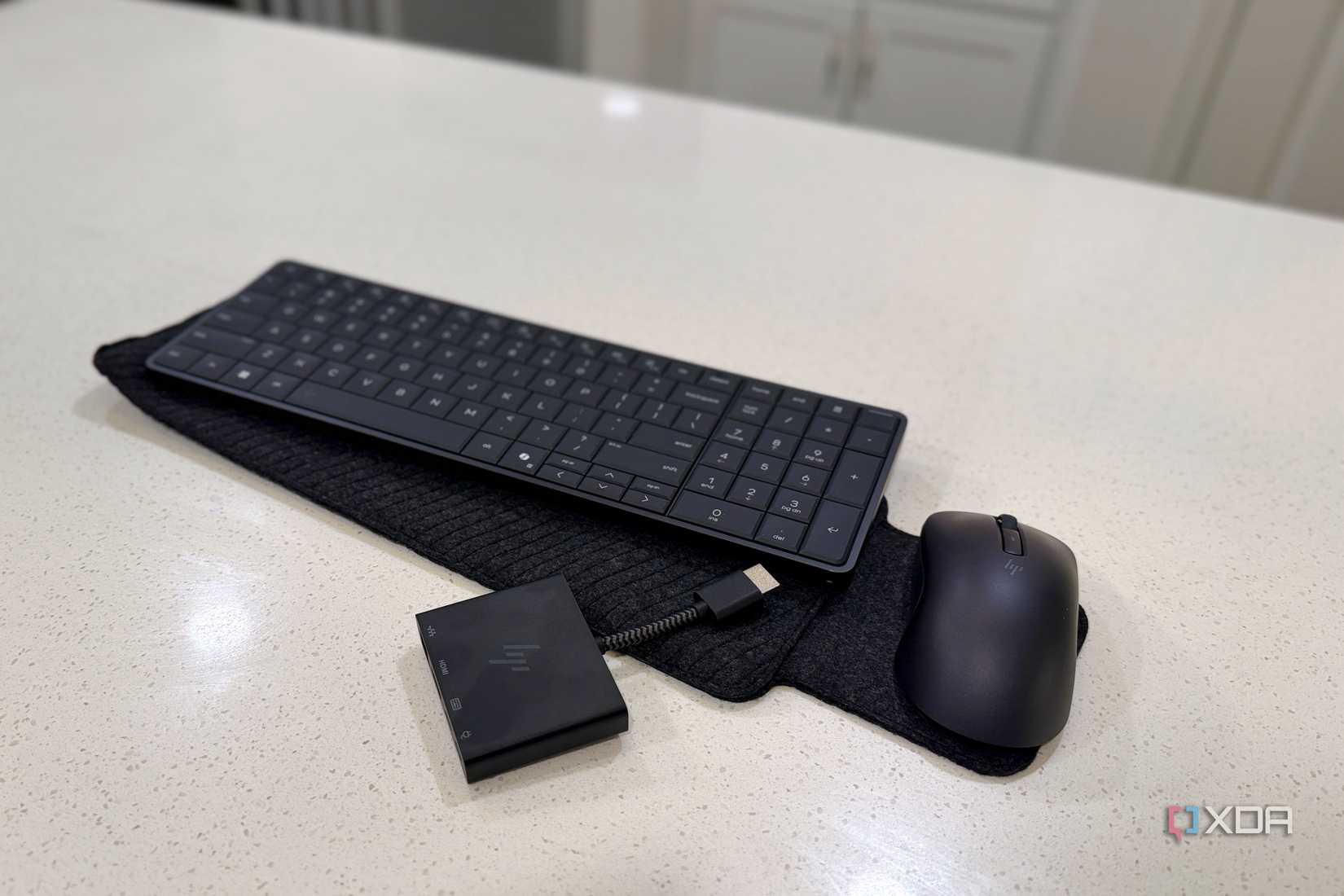 hp eliteboard g1a on counter with all its peripherals