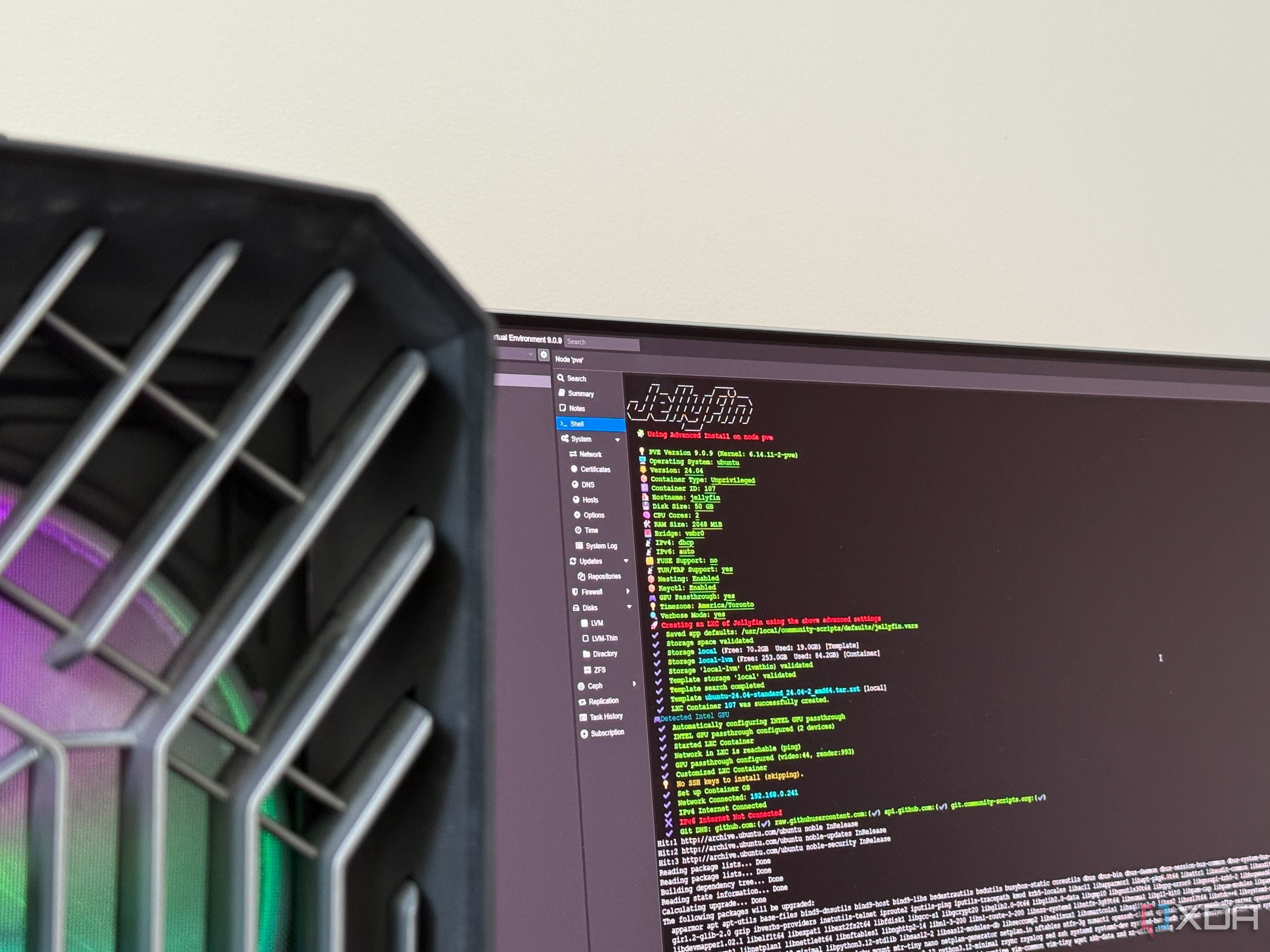 A photo of a monitor showing the build of the jellyfin community script on Proxmox LXC