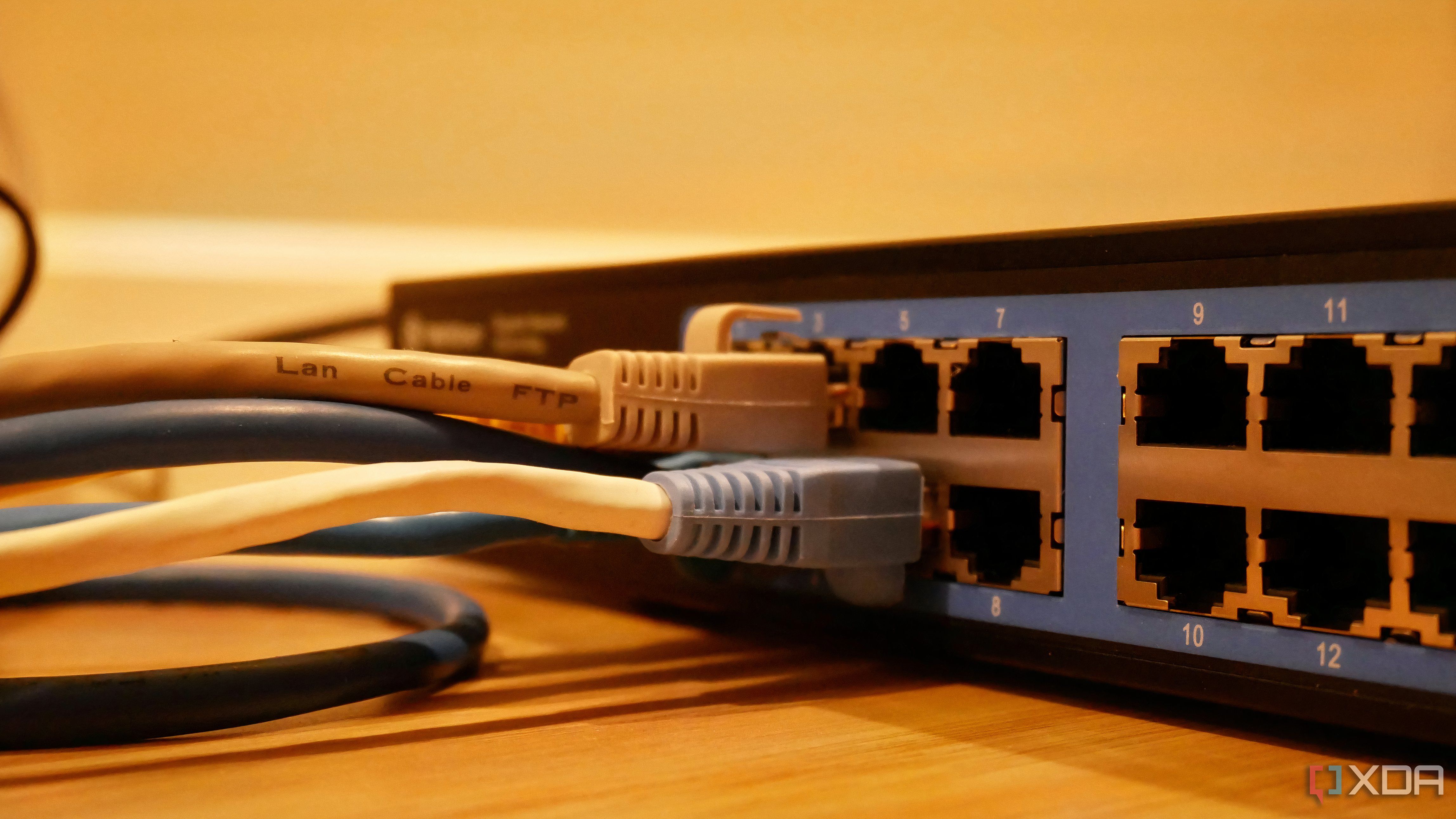 Network switch with two Ethernet cables plugged into the ports.