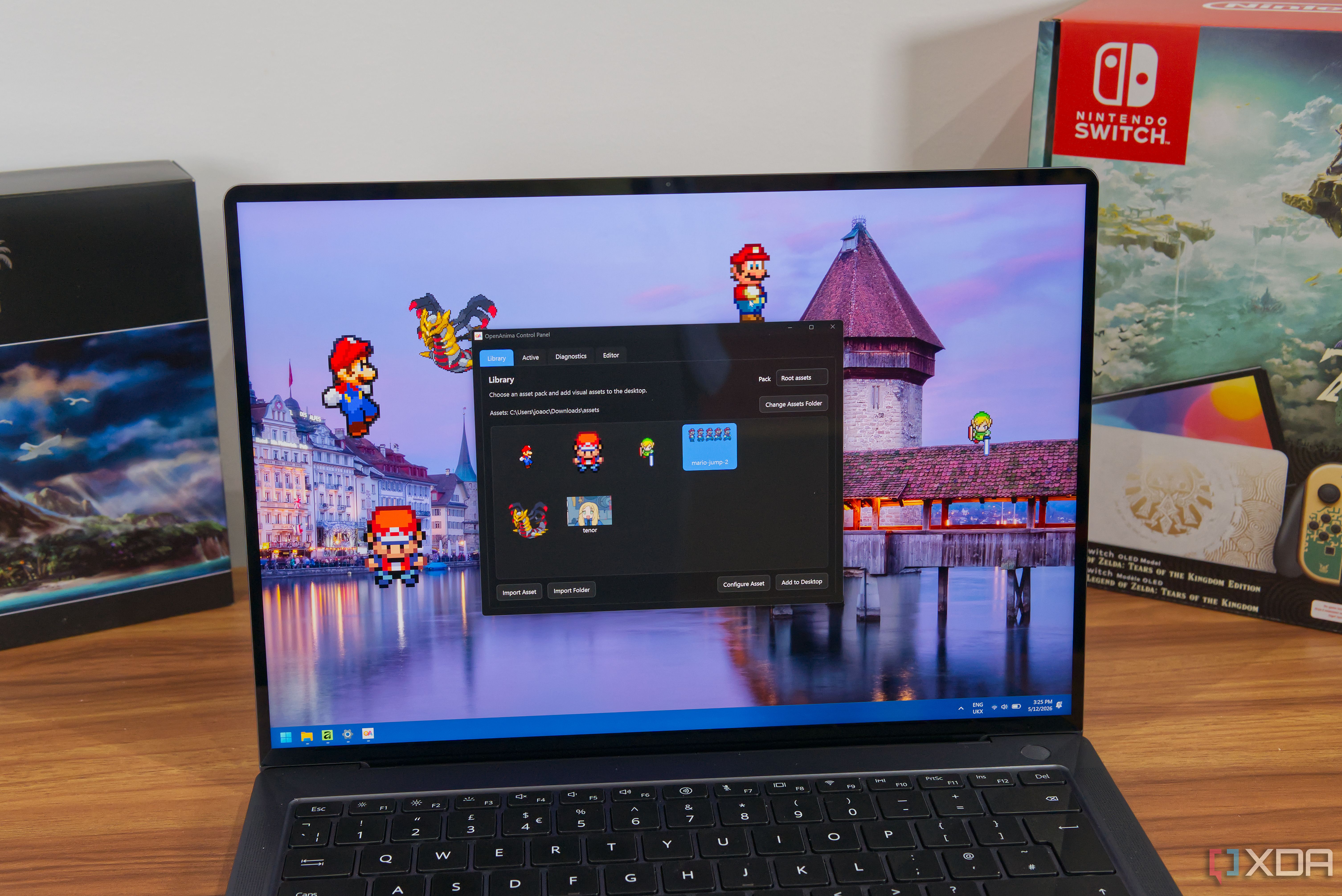 A laptop showing the OpenAnima app with various images on the desktop