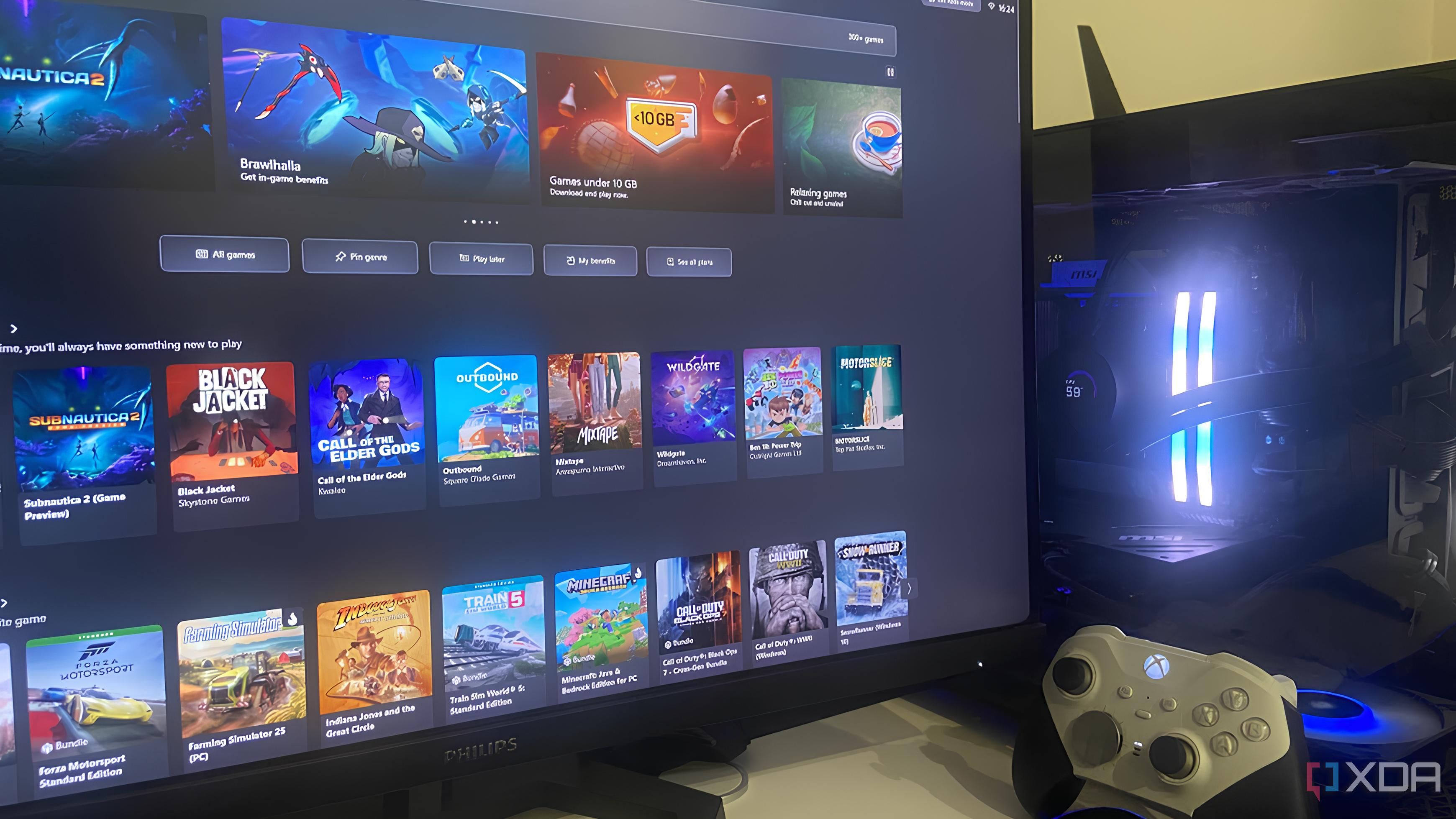Xbox Mode running on a gaming desktop PC as an Xbox Elite 2 controller sits against the tempered glass panel.