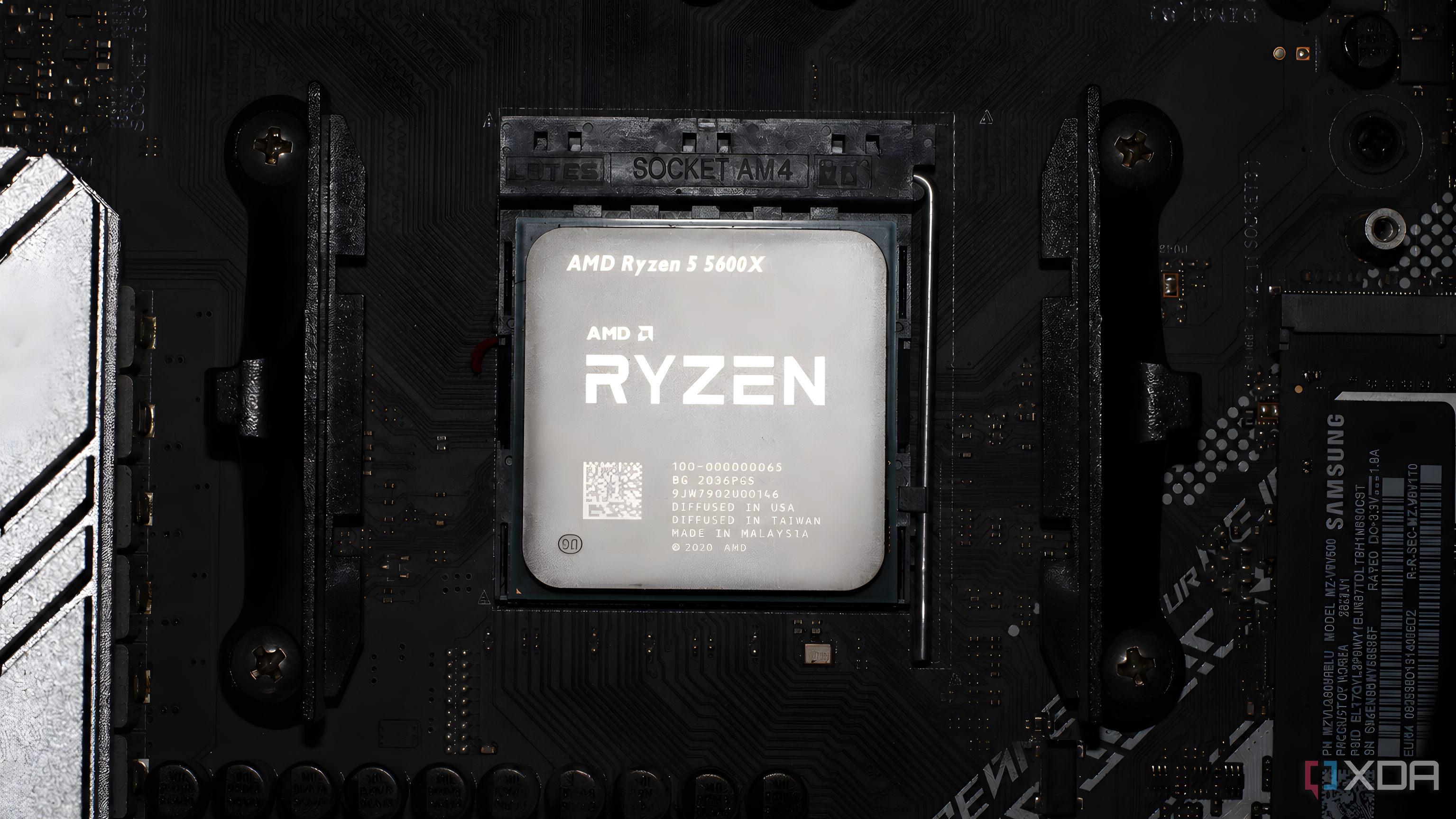 An image of a Ryzen 5 5600X slotted in on an AM4 motherboard.