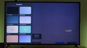 A TV displaying Arc launcher customization options for the wallpaper gradient