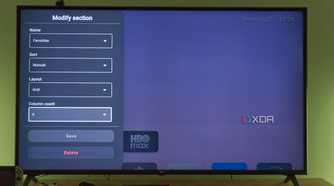 A TV displaying settings for customizing a section in Arc Launcher