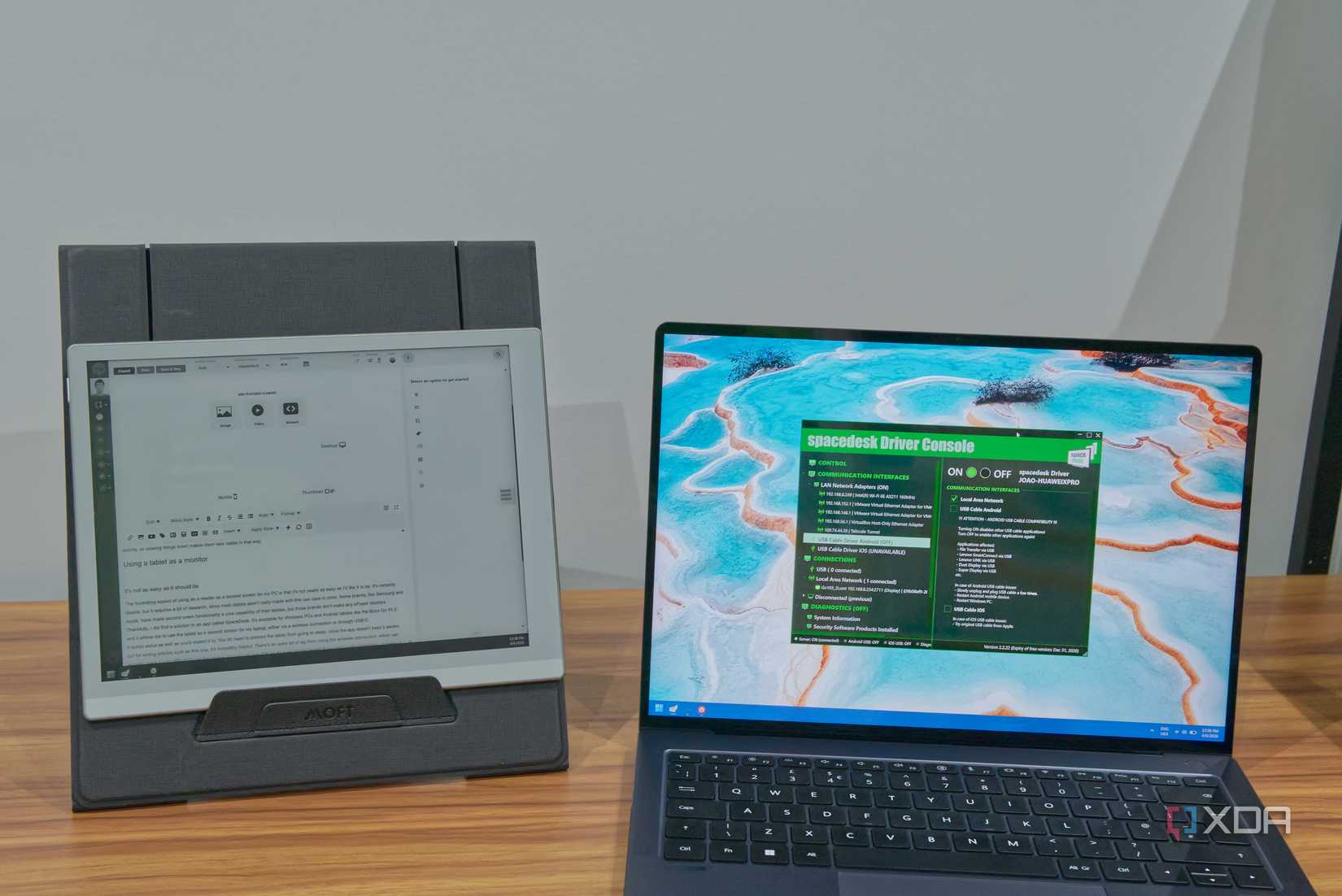 A laptop next to an e-reader used as a second screen