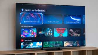 The Hisense U7SG on a wooden media console displaying the Google TV home screen with Learn with Gemini and movie recommendations.