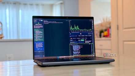 A picture of an OLED laptop opened on a white table showing the IDE.