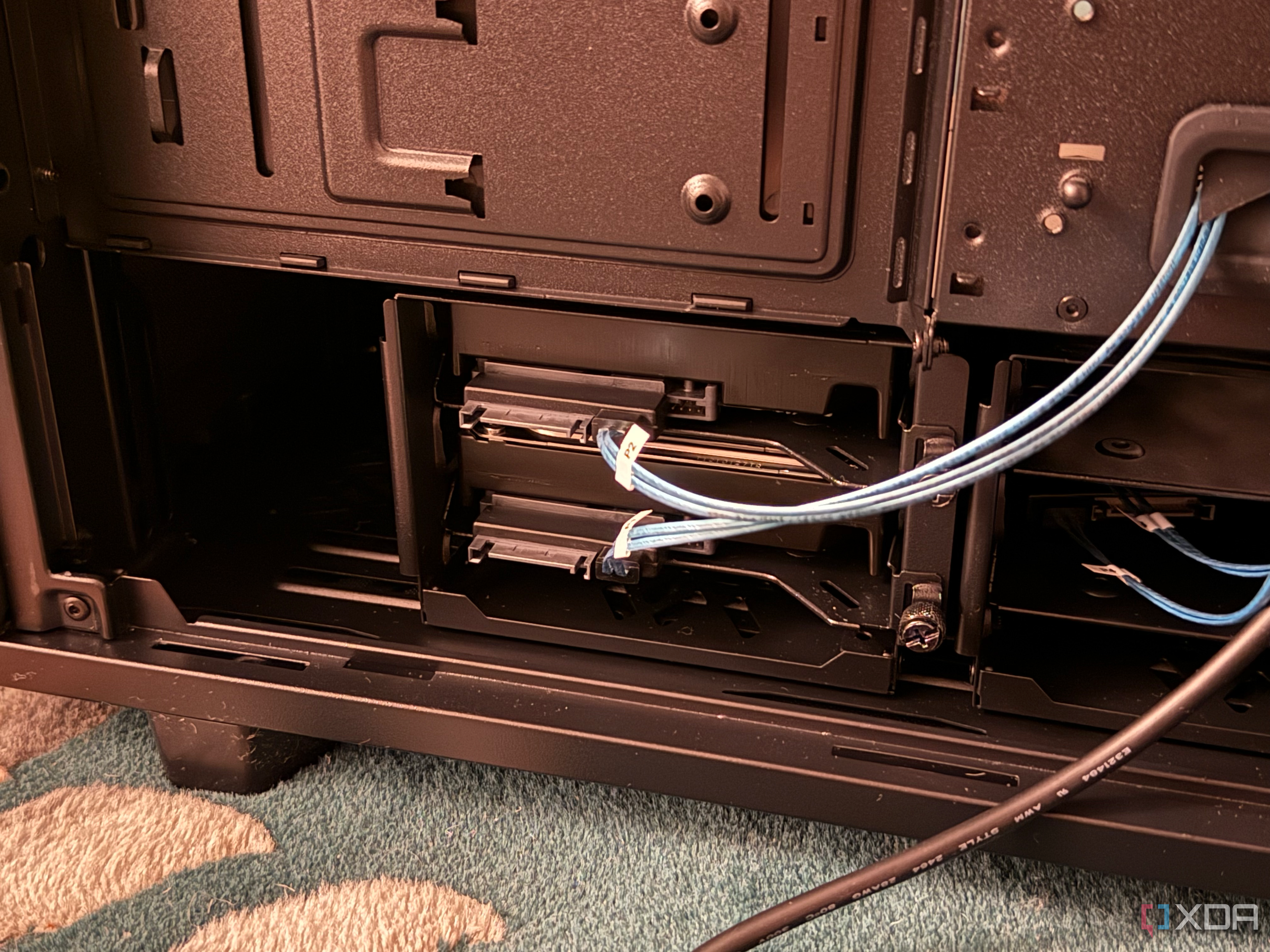 A photo of two SAS drives installed without their power connections