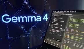 Claude running on an M1 Mac with Gemma 4 on a large display behind it.