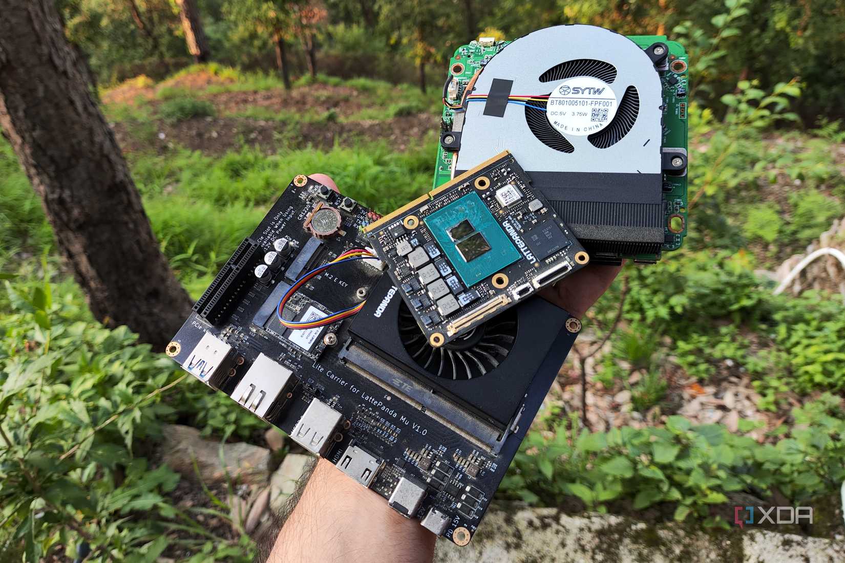A person holding multiple N100 systems
