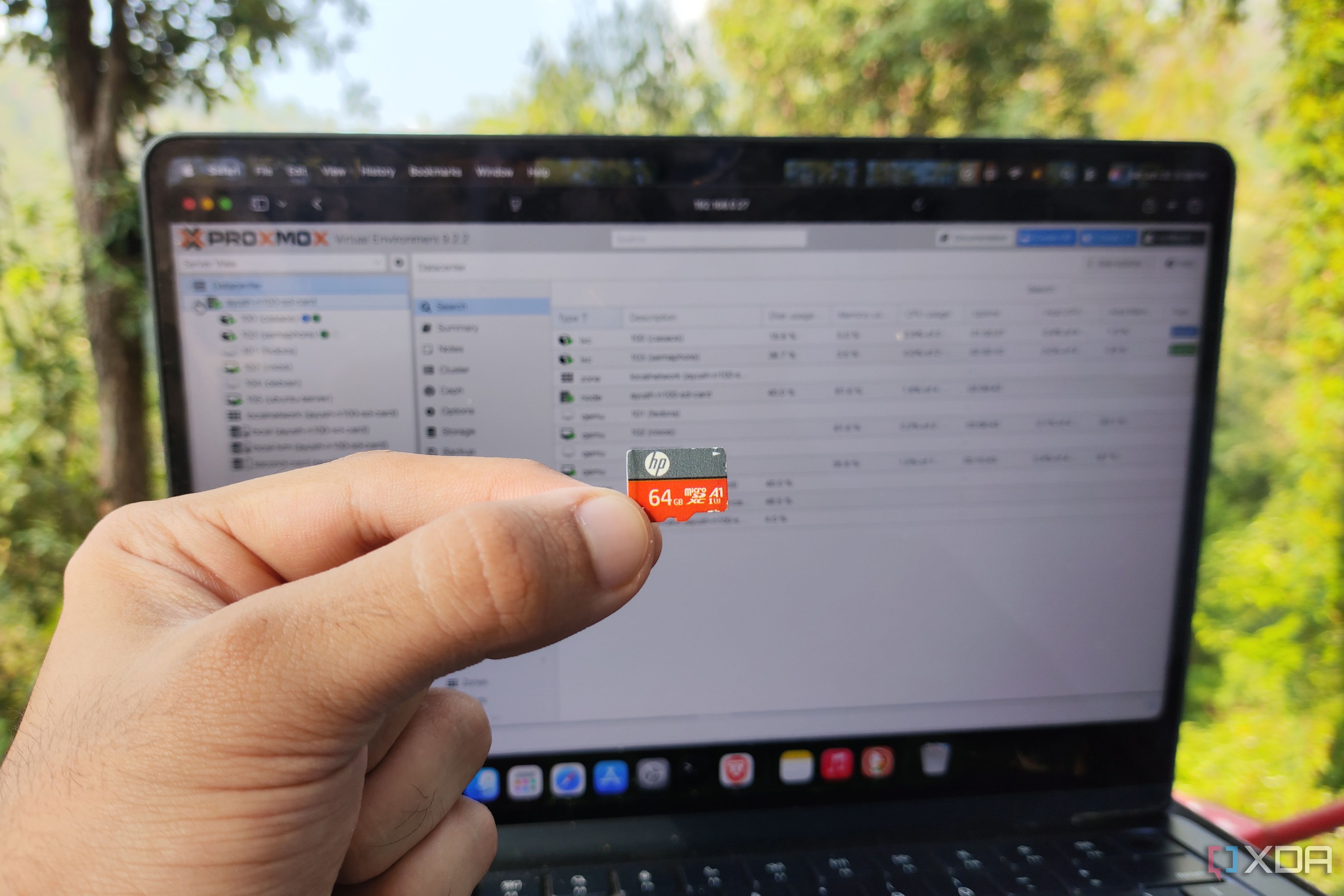 A person holding a microSD card