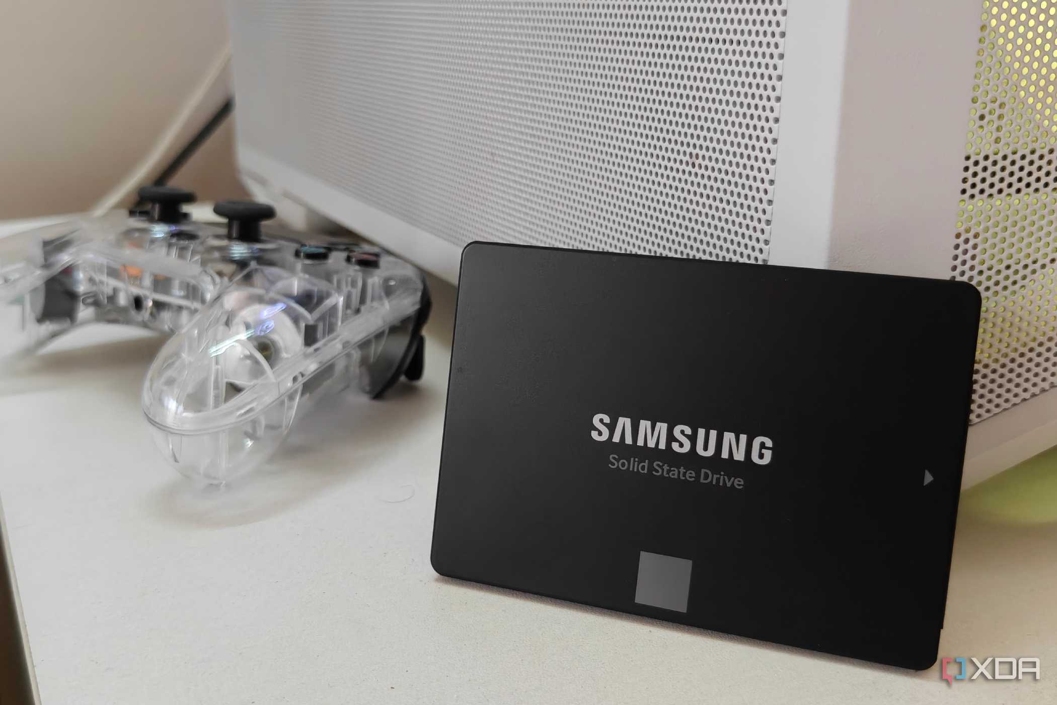 Samsung SATA SSD propped up against a white PC case.