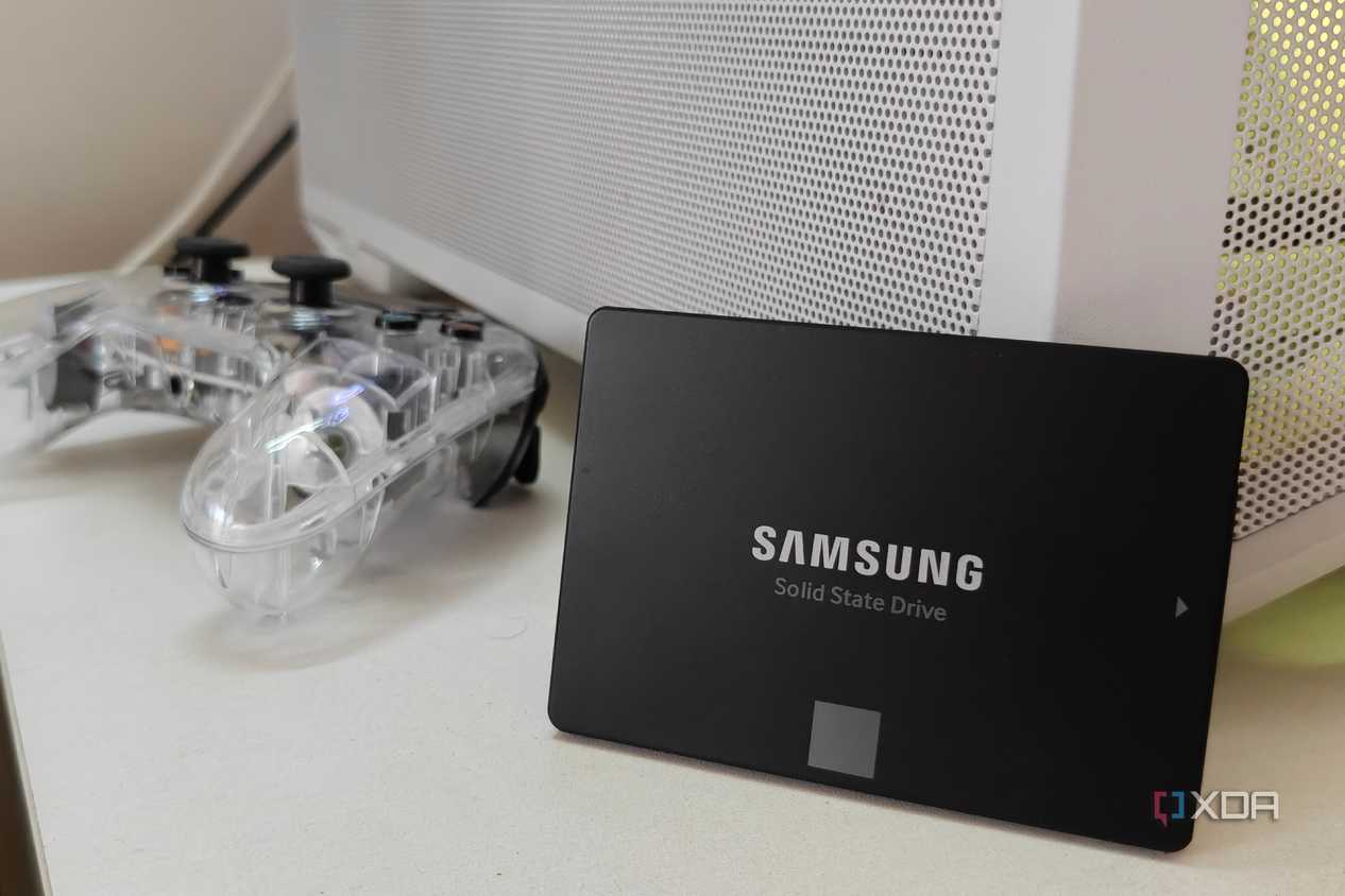 Samsung SATA SSD propped up against a white PC case.