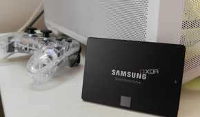 Samsung SATA SSD propped up against a white PC case.