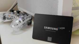 Samsung SATA SSD propped up against a white PC case.