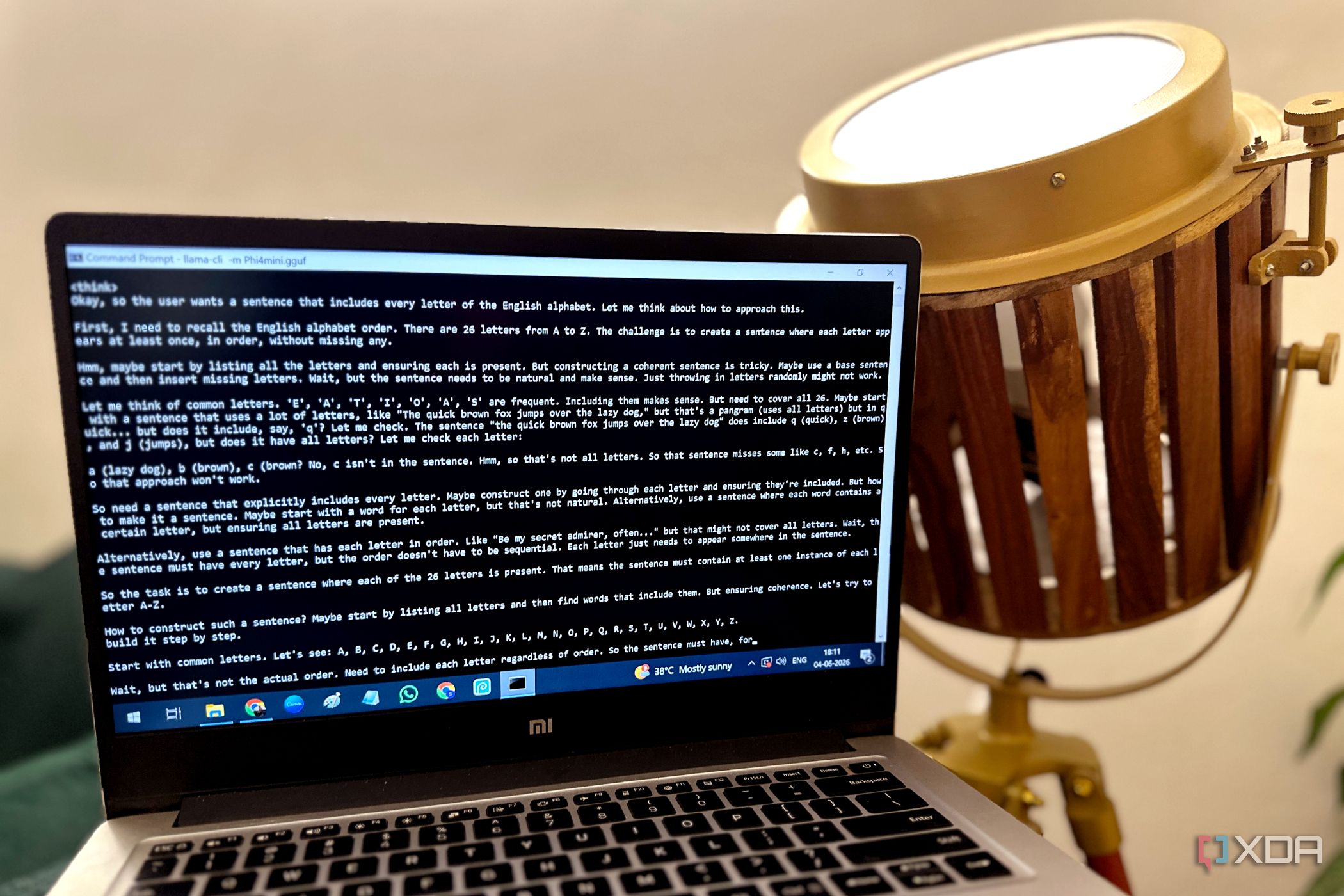 Using Llama.cpp on a Windows 10 laptop next to a spotlight lamp.