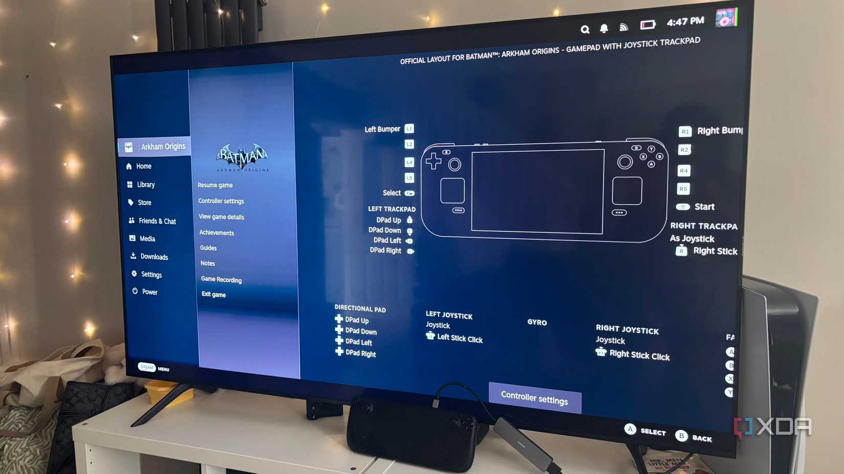 Steam Deck on TV docked showing steam deck controls