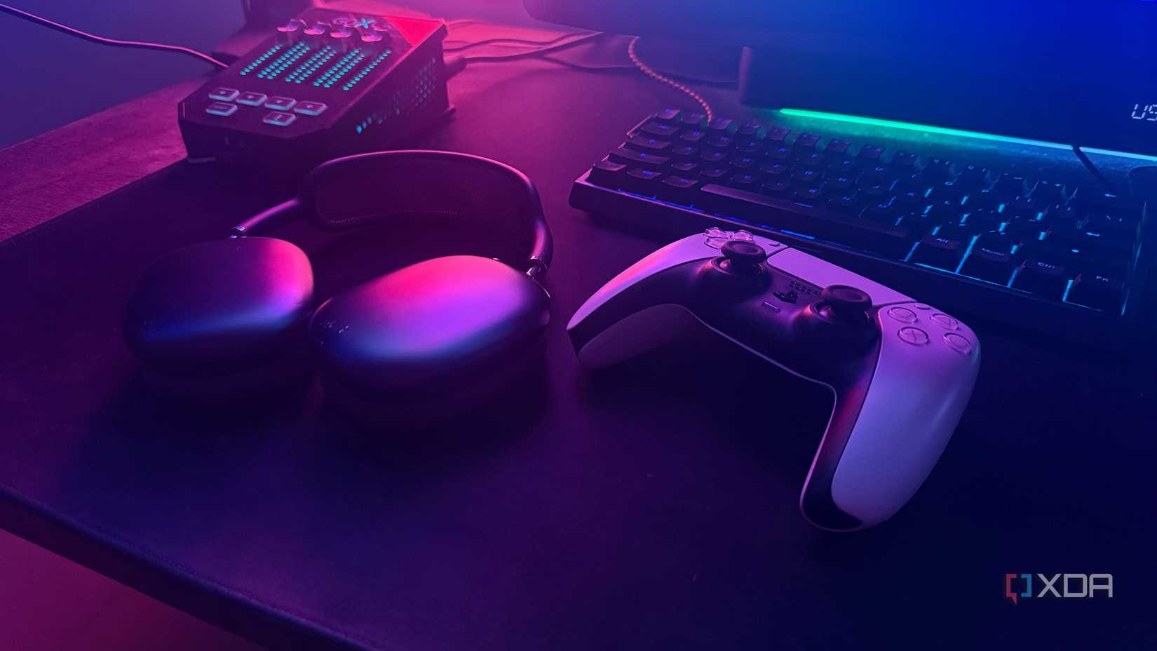 AirPods Max and PS5 controller next to each other