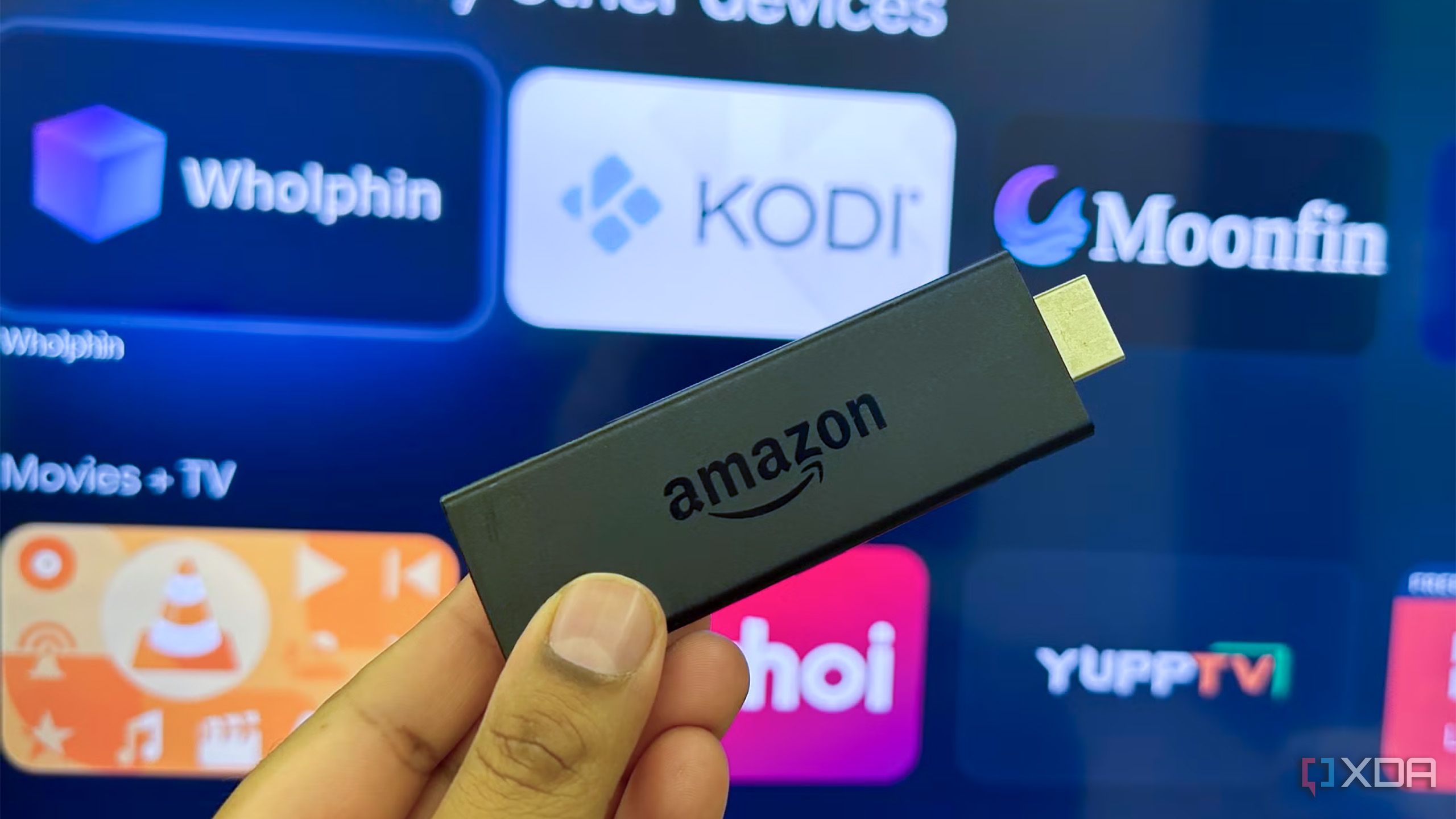 An Amazon Fire TV Stick in front of a TV