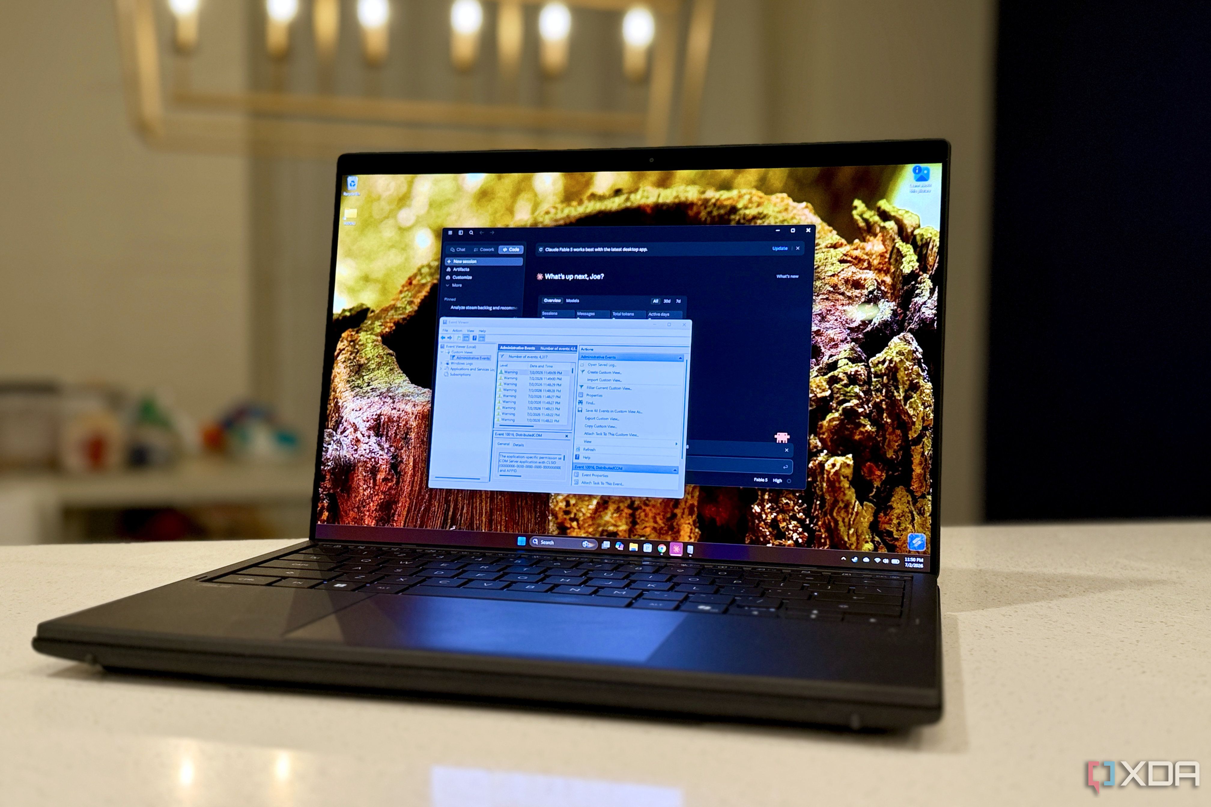 claude and event viewer open on a laptop screen