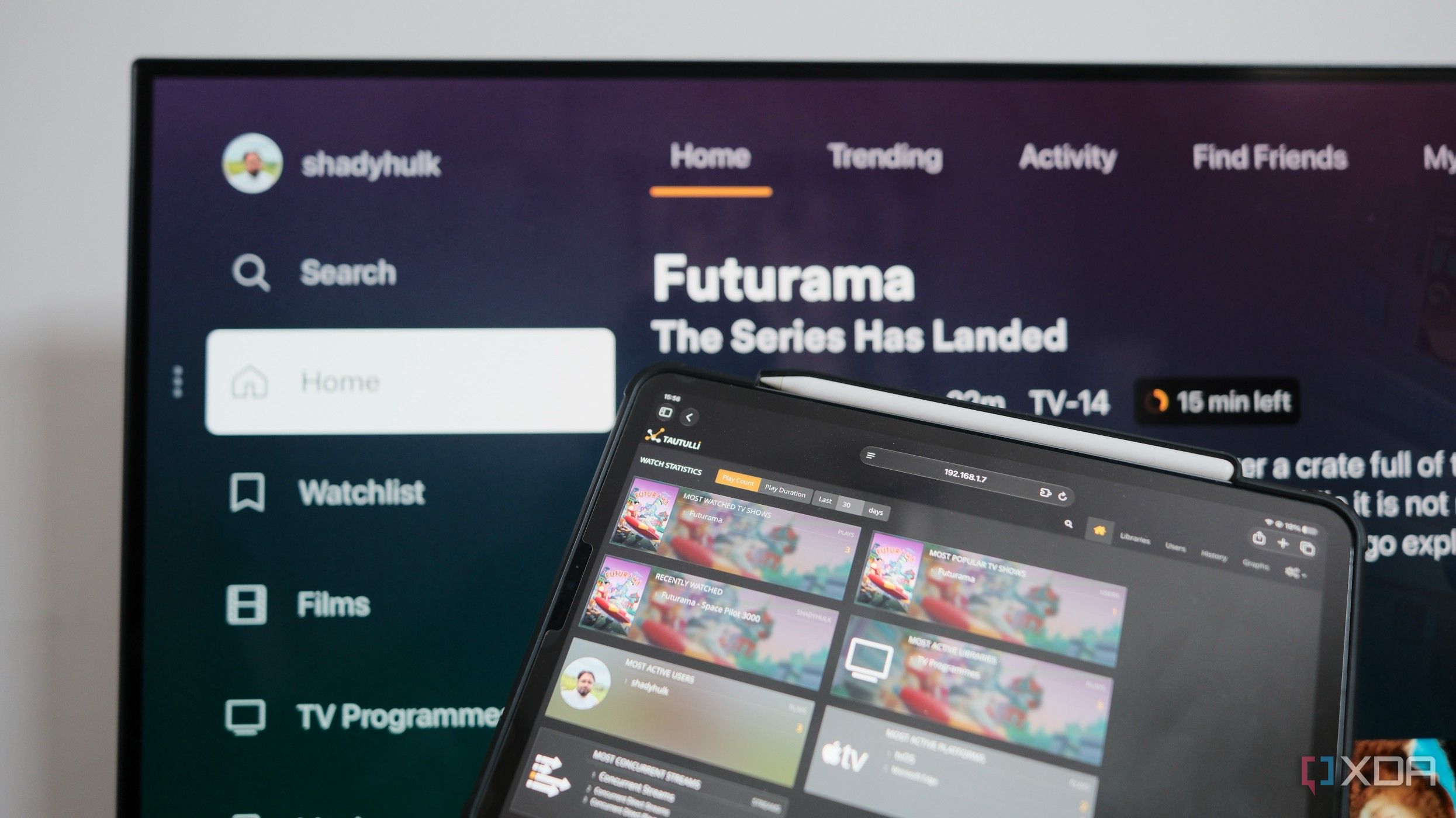 Photo of Plex Server interface on a TV with companion app on a tablet