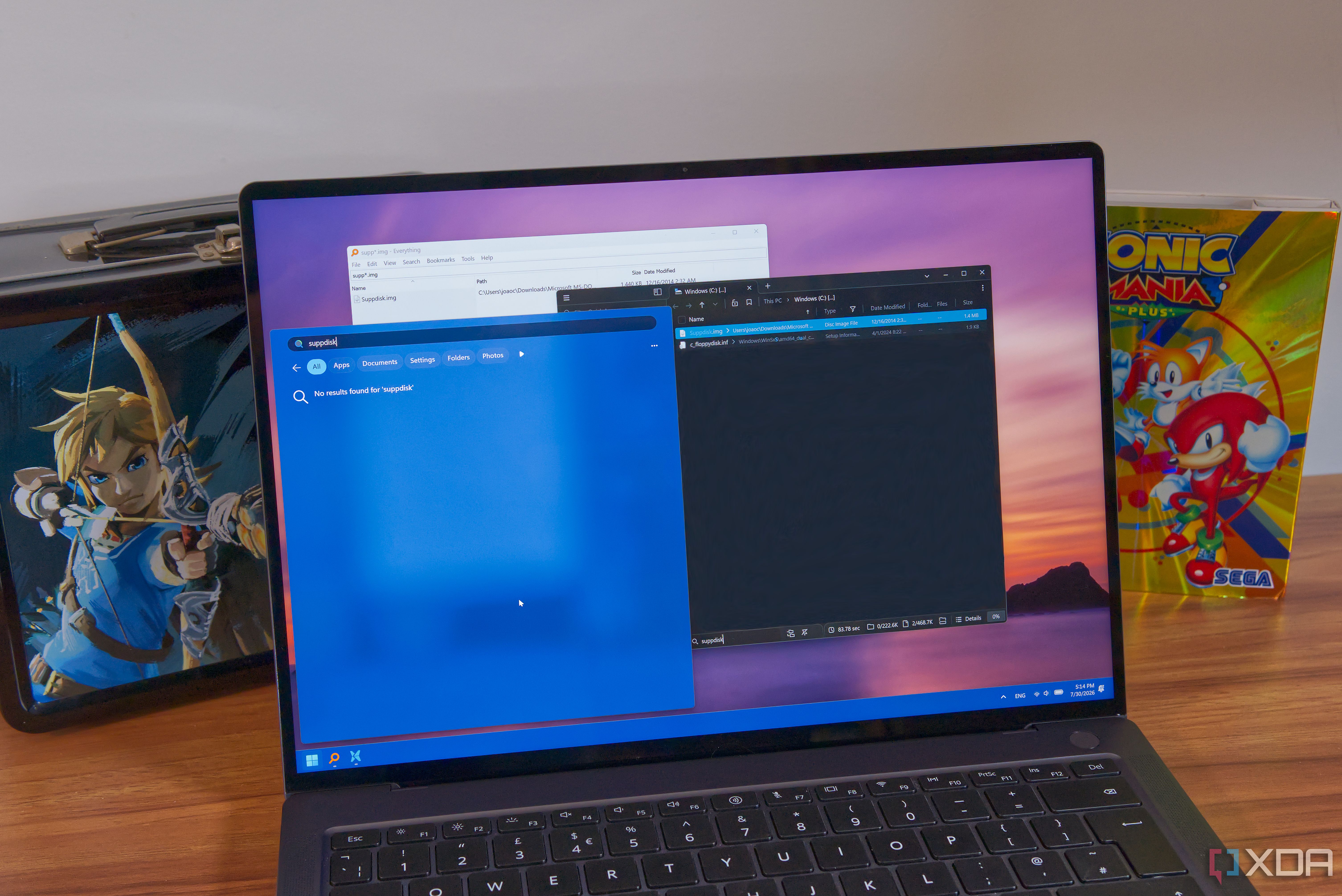 A Windows 11 laptop showing search results in Windows Search, File pilot, and Everything