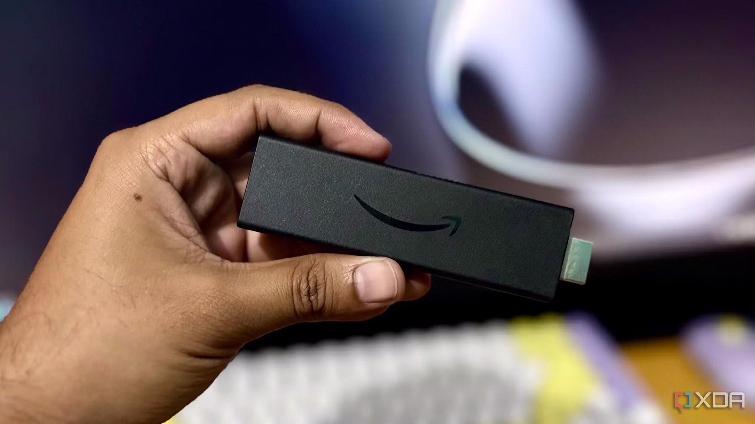 Someone holding the Fire TV Stick 