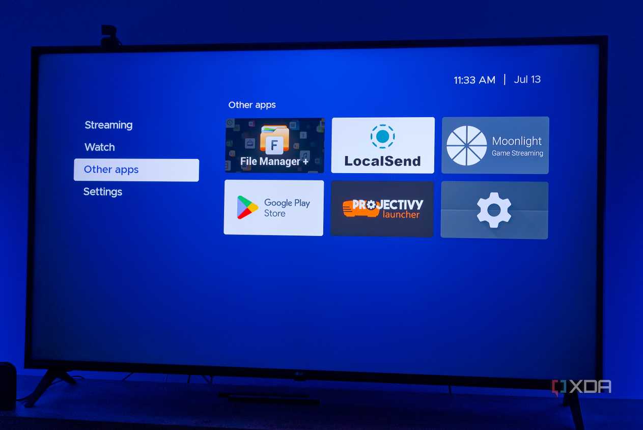 A TV displaying Kyu launcher for Android TV with a group of non-streaming apps
