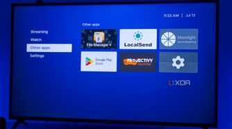 A TV displaying Kyu launcher for Android TV with a group of non-streaming apps