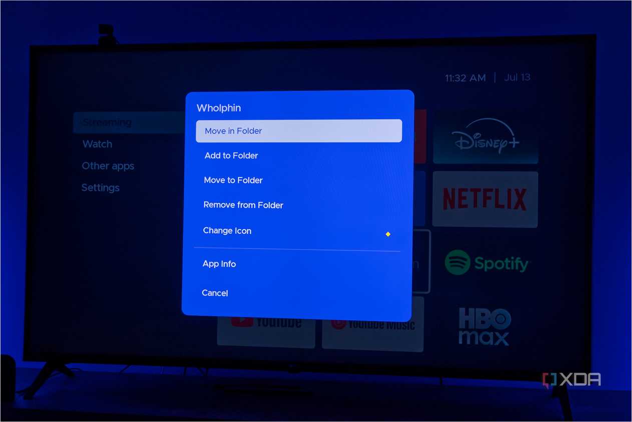 A TV displaying Kyuu Launcher for Android TV, with a menu of actions that can be taken on an app
