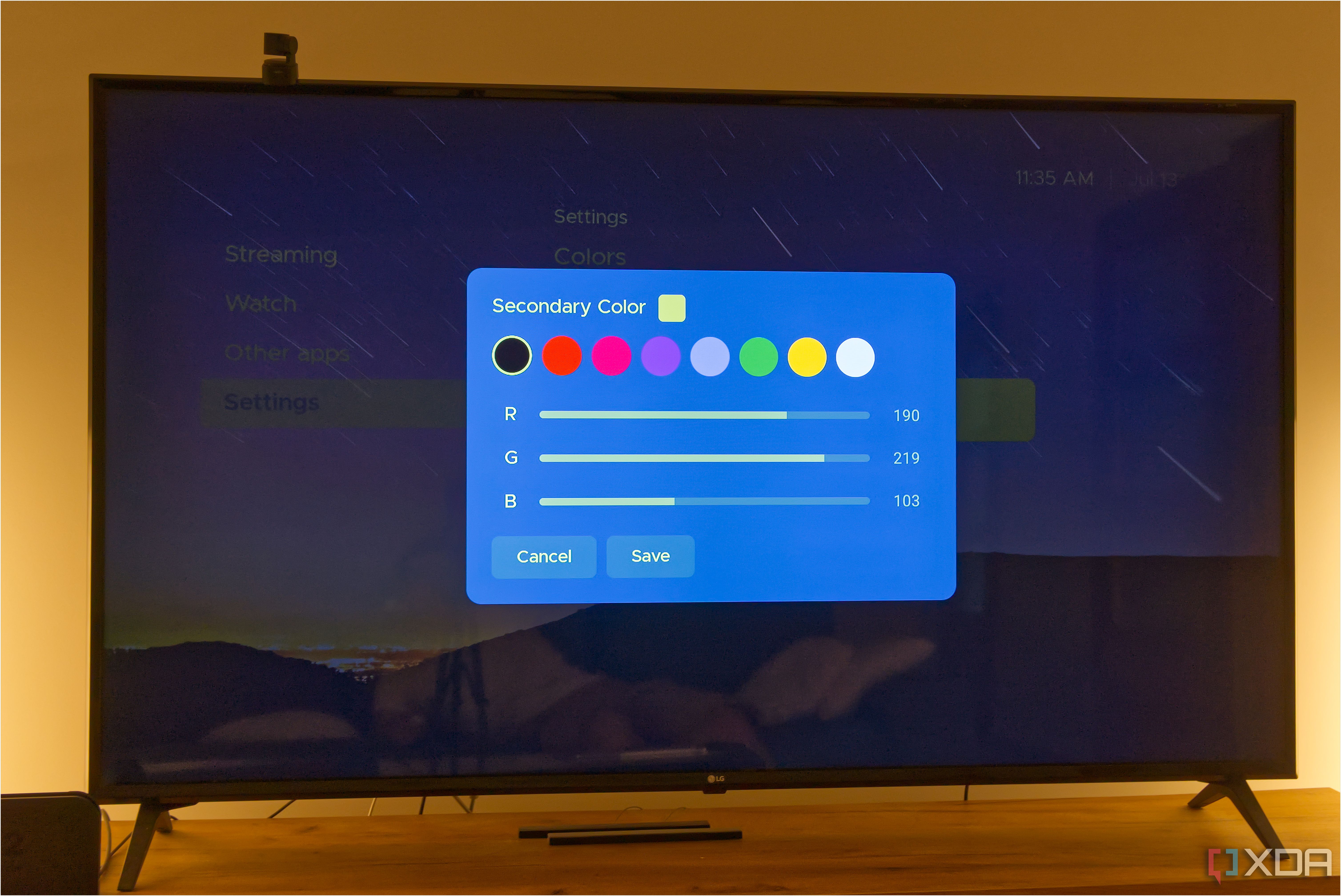 A TV displaying the color sliders in Kyu Launcher for Android TV when adjusting the secondary theme color