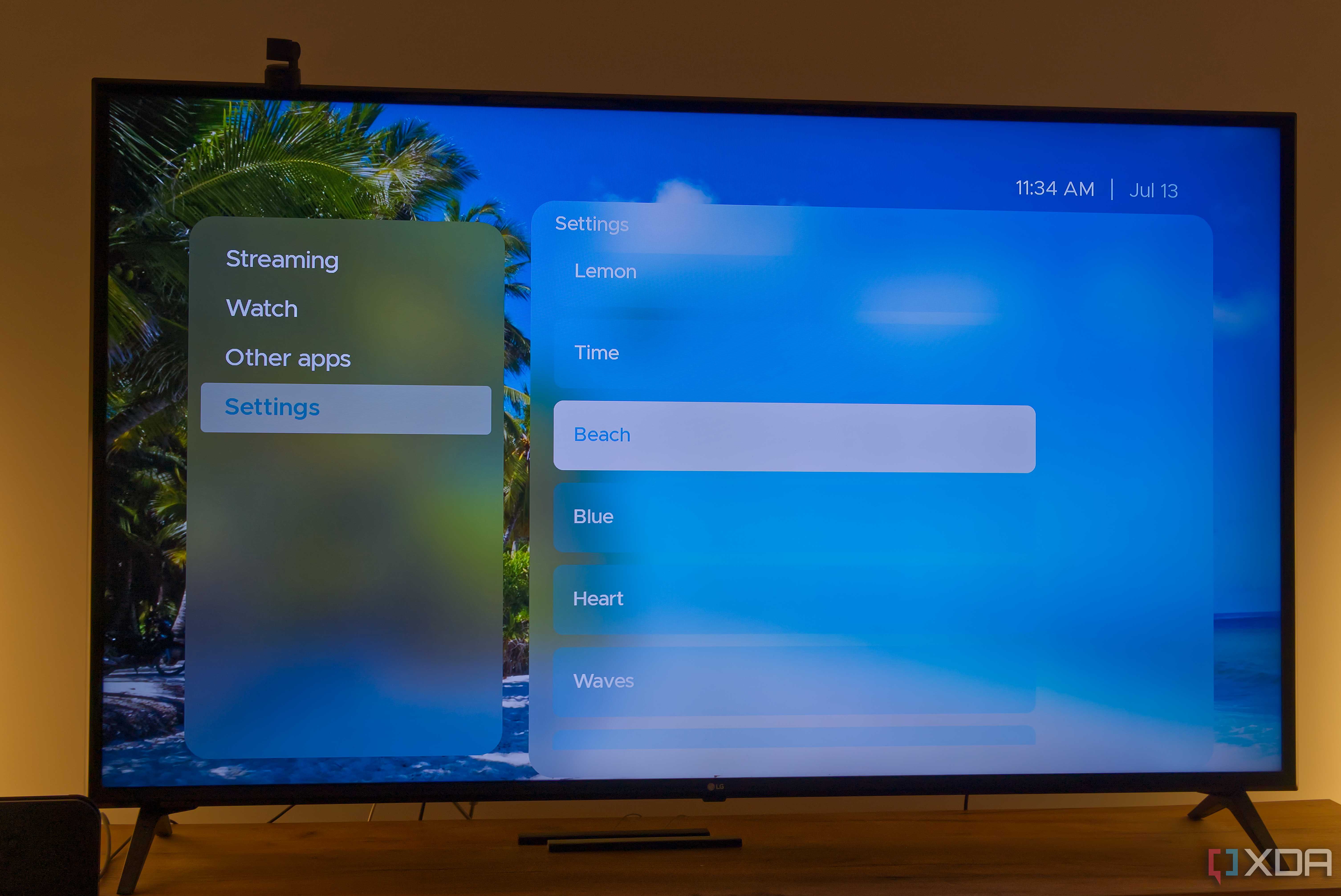 A TV displaying the Beach theme in Kyu launcher for Android TV