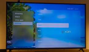 A TV displaying the Beach theme in Kyu launcher for Android TV