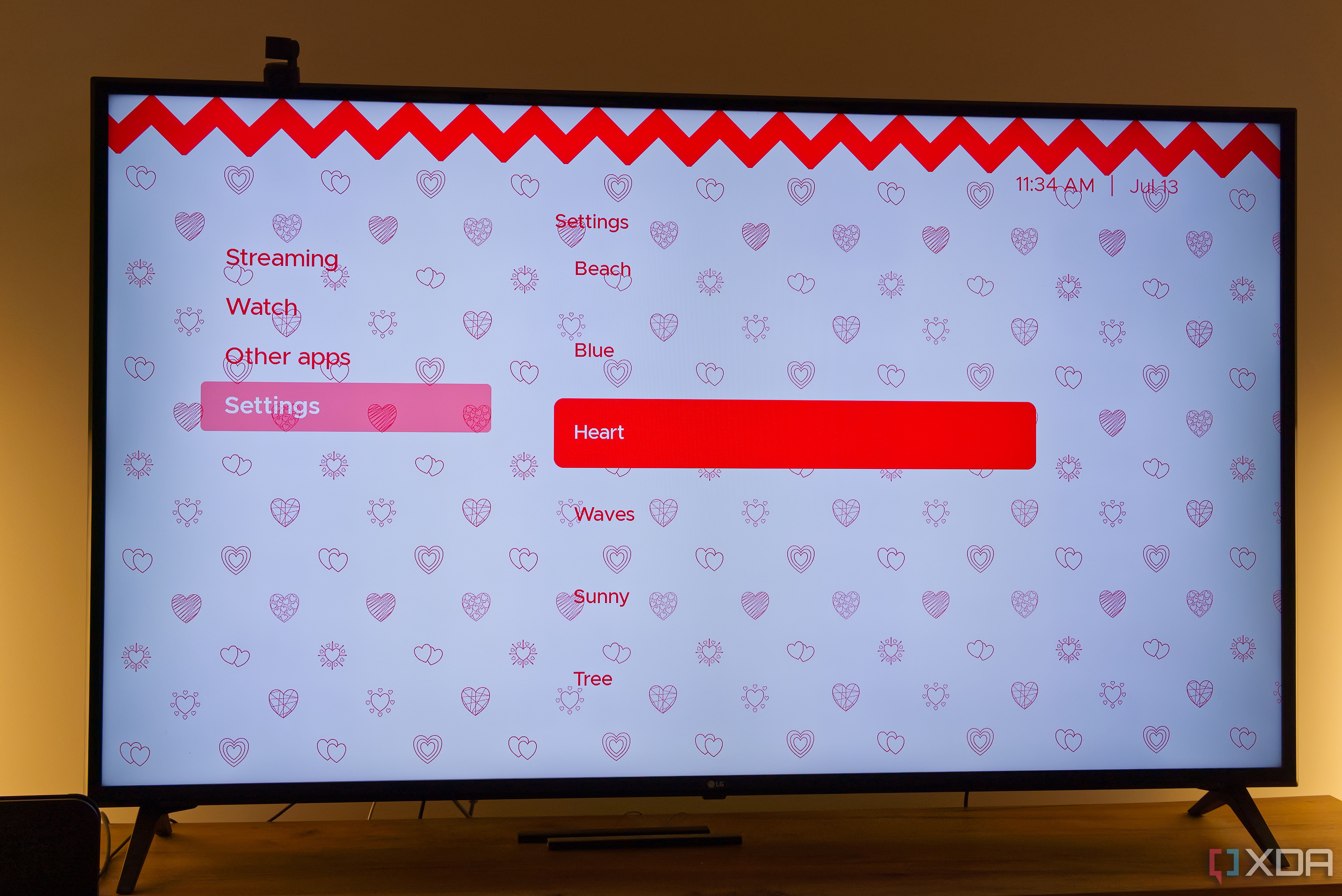 A TV displaying the Hearts theme in Kyu launcher for Android TV