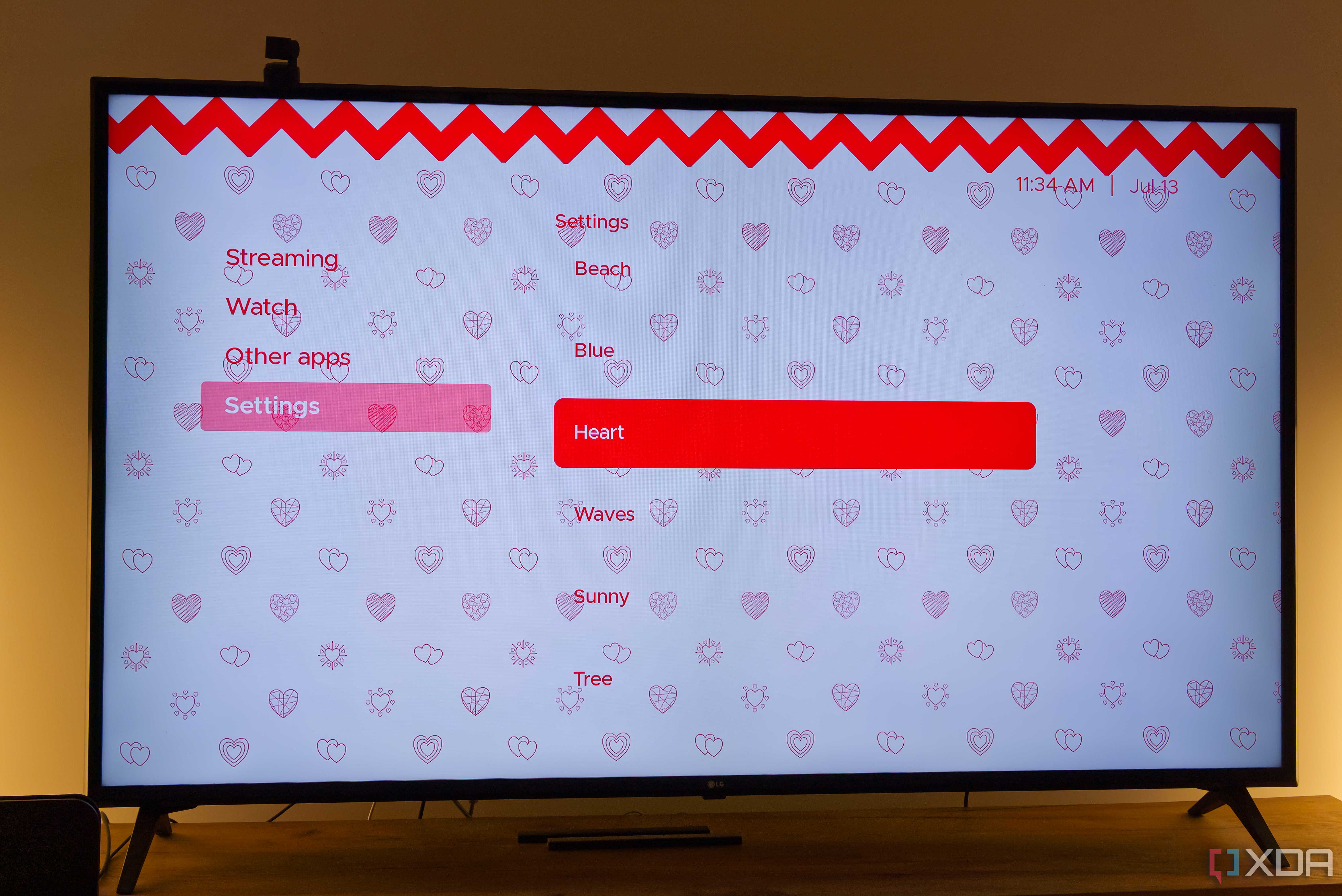 A TV displaying the Hearts theme in Kyu launcher for Android TV