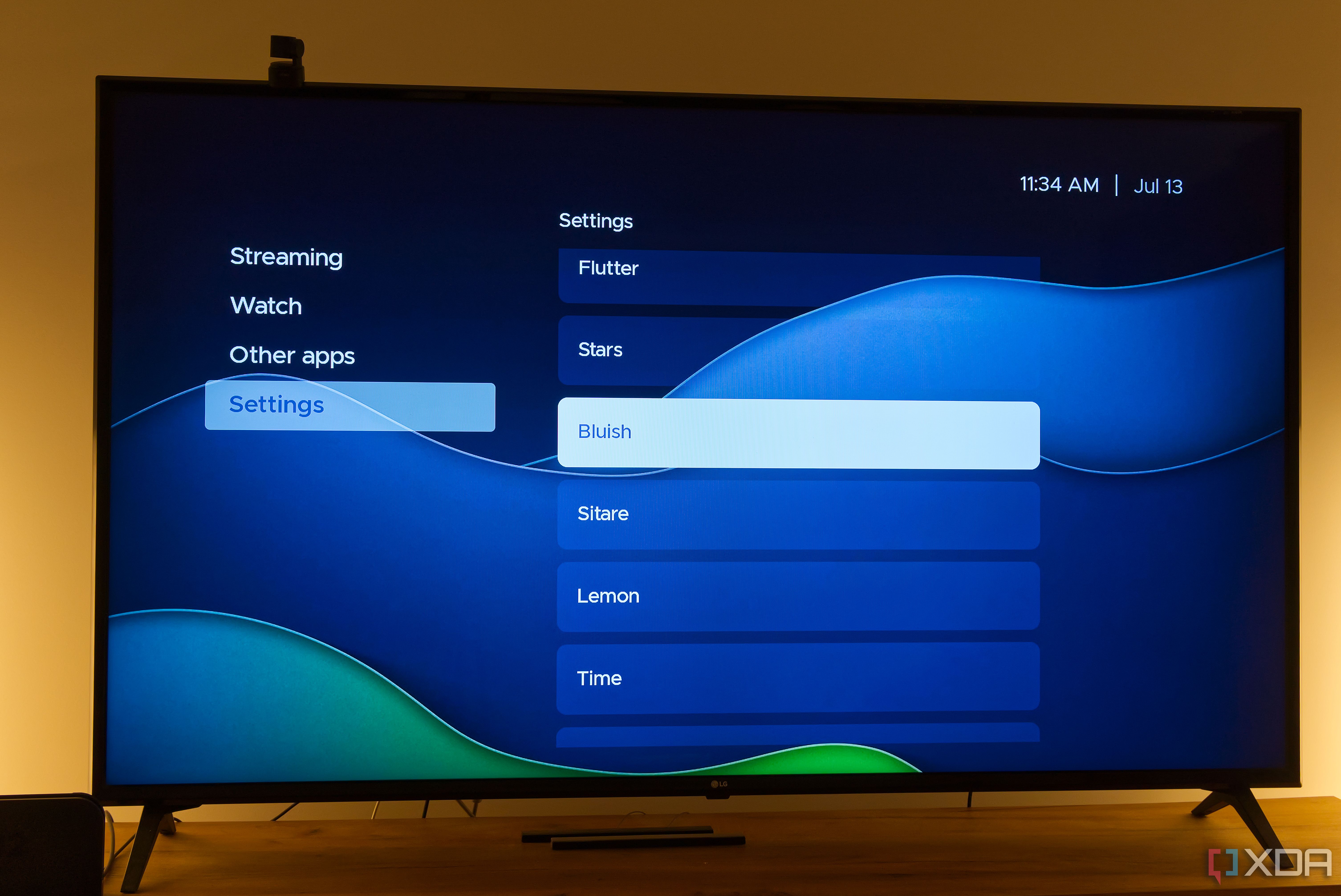 A TV displaying the Bluish theme in Kyu launcher for Android TV