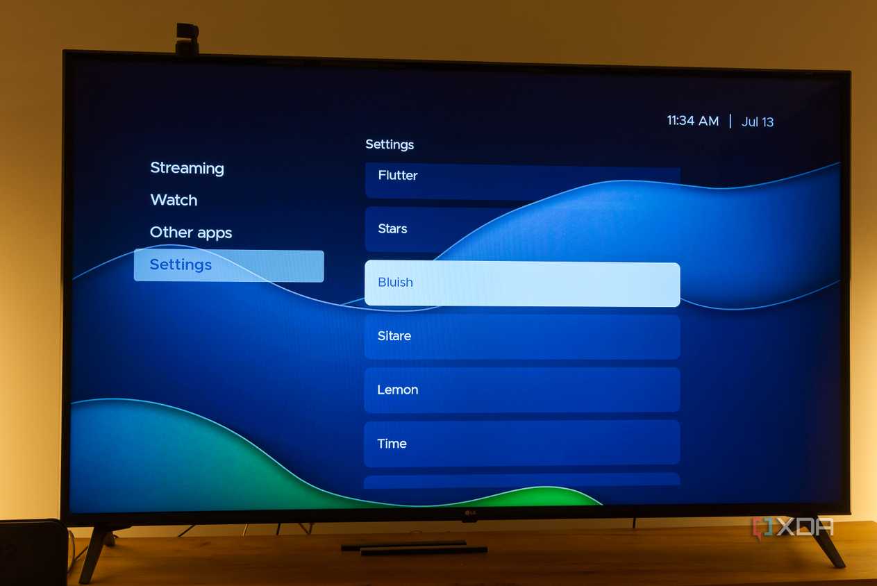 A TV displaying the Bluish theme in Kyu launcher for Android TV
