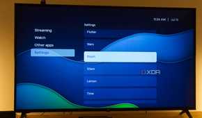 A TV displaying the Bluish theme in Kyu launcher for Android TV