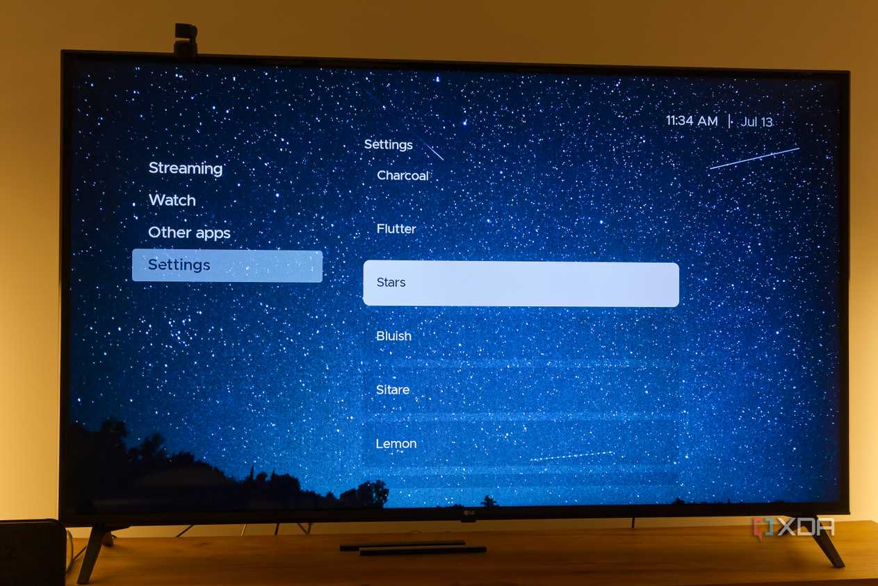 A TV displaying the Stars theme in Kyu launcher for Android TV