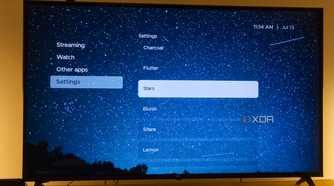 A TV displaying the Stars theme in Kyu launcher for Android TV