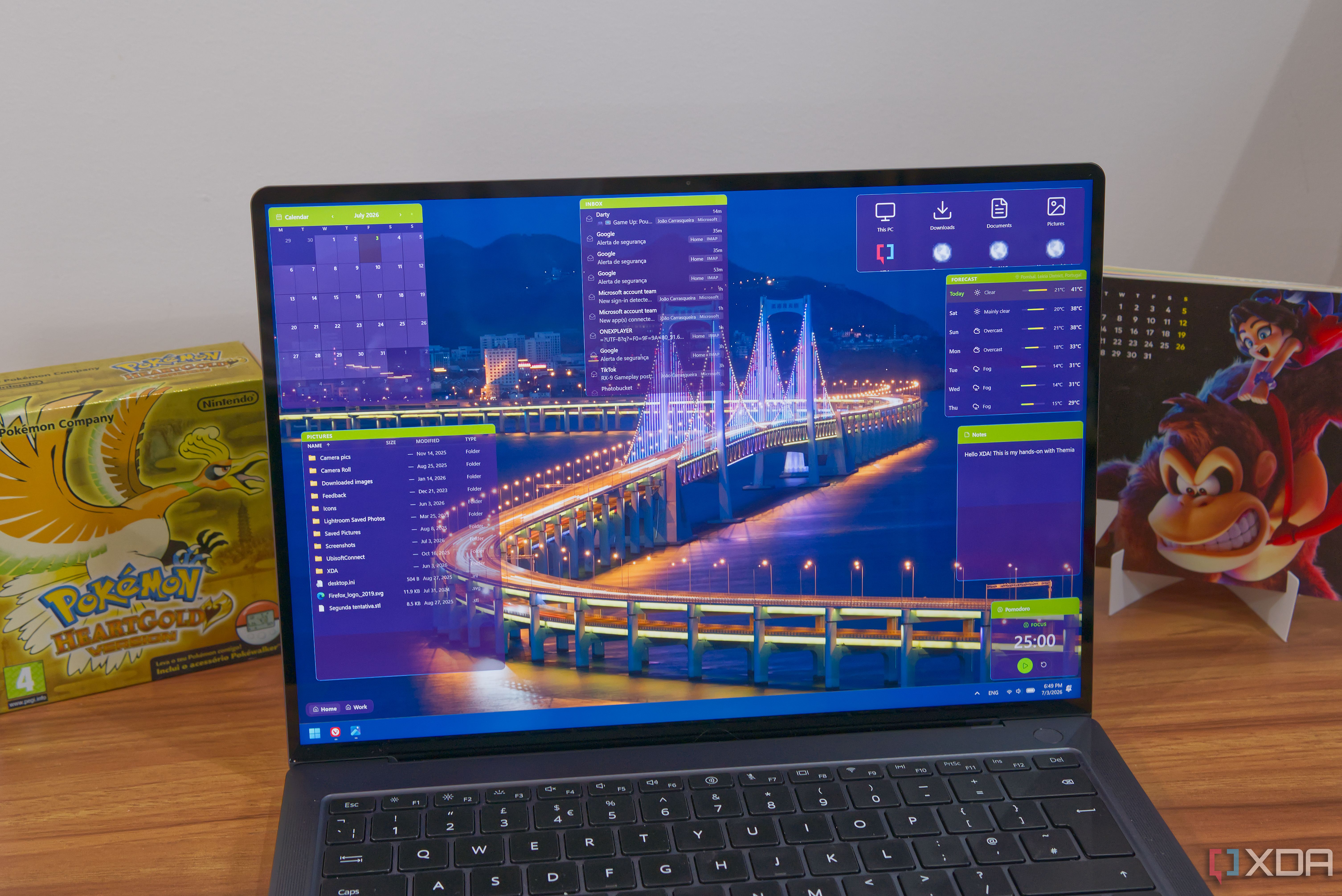 A Windows 11 laptop showing the desktop with various Themia widgets