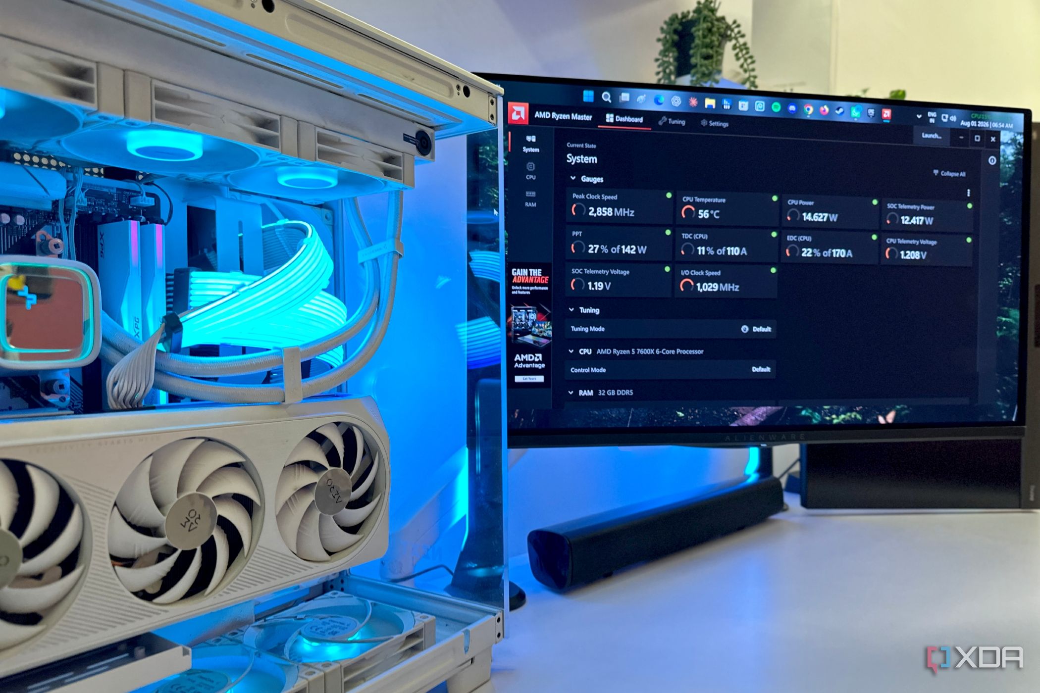 ryzen master utility next to open pc case with gpu