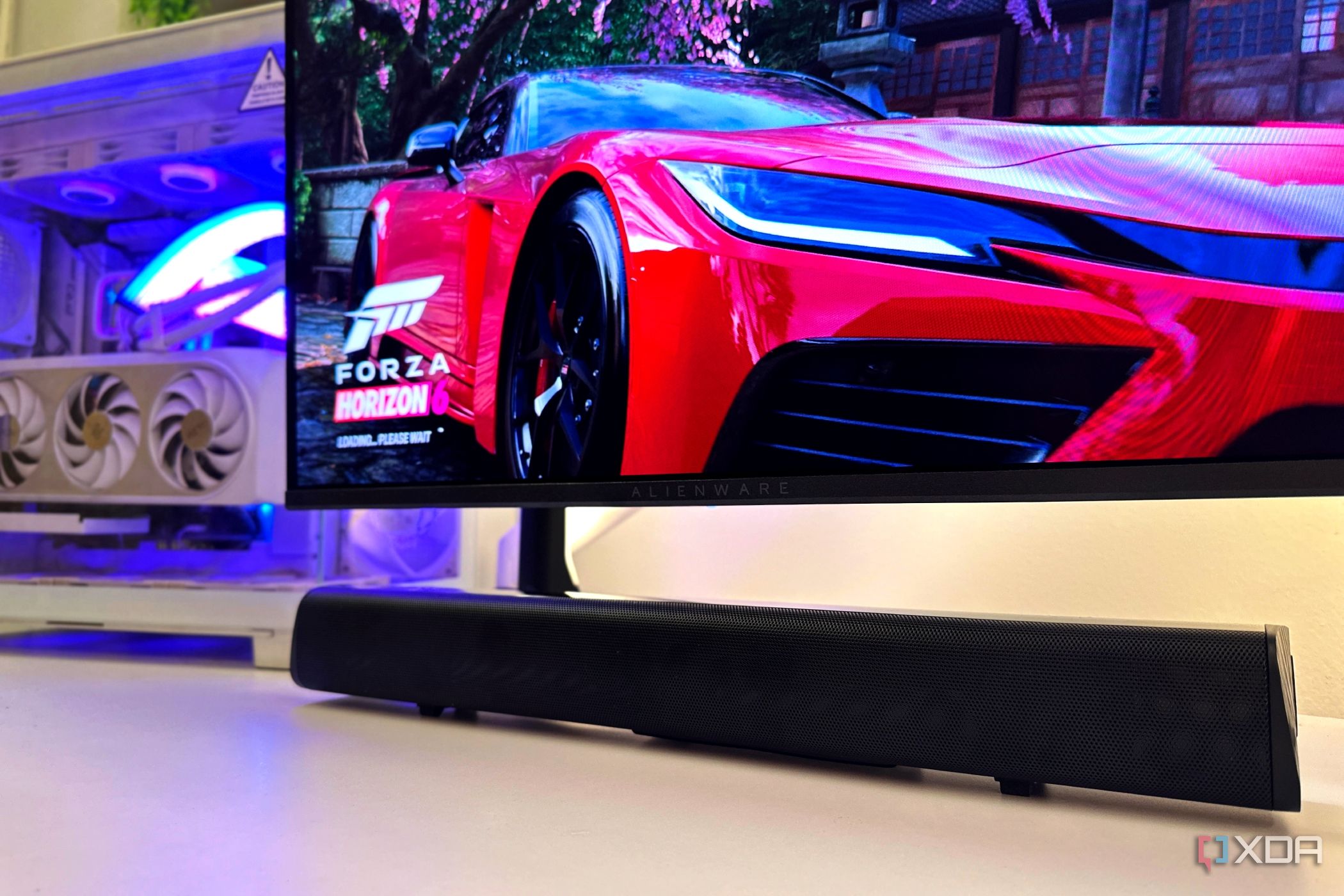 Soundbar on PC desk with Forza Horizon 6 in the background.