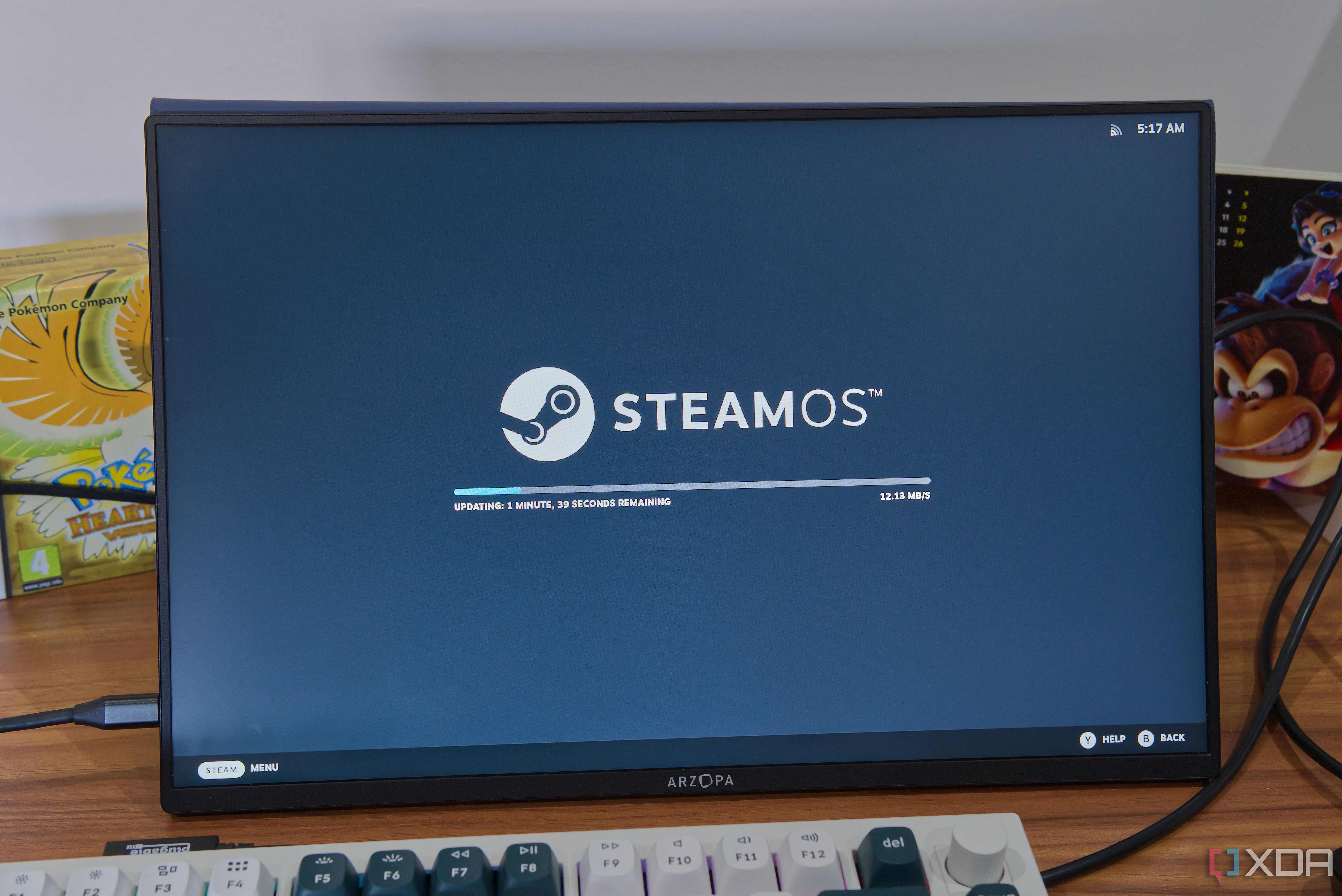 A portable monitor displaying the SteamOS update screen
